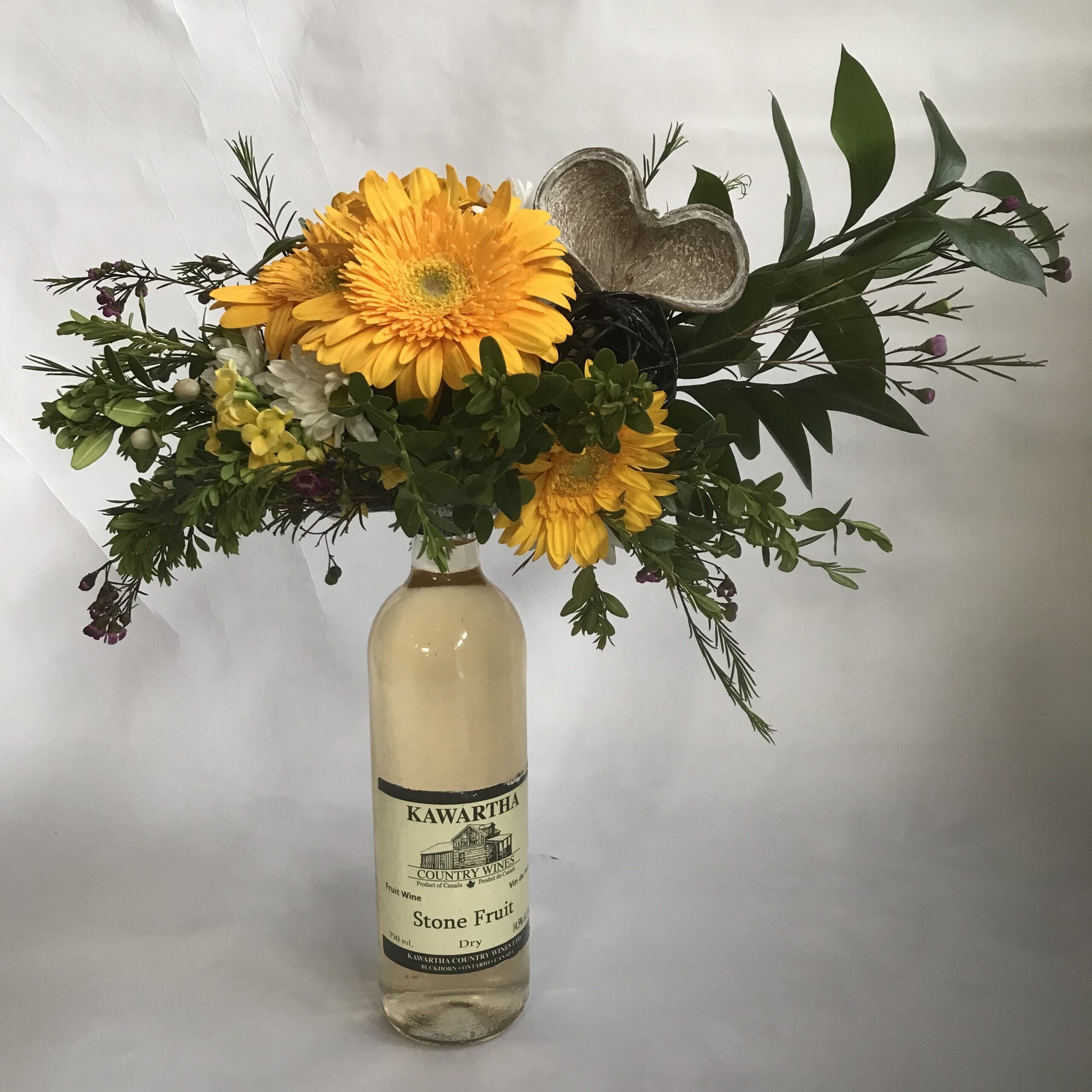 wine bottle floral arrangement by Eufloria the Buckhorn Ontario Florist